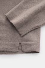 Close-up view of the sleeve and hem of the 04651/ A trip in a bag Crew neck jumper 'Ultimate' grey, showing fine knit pure wool fabric with a soft feel, regular fit, crew neck, and double-layered seams; casual and comfortable for cold days with a casual l