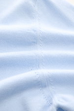 Close-up front view of B.F. Knitwear Crew neck jumper light blue showing fine knit, soft pure cotton fabric, slim fit, ribbed bands, and crew neck details.