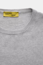 Close-up front view of B.F. Knitwear Crew neck jumper grey melange, showing fine knit pure cotton fabric with soft feel and ribbed comfortable bands, slim fit, and crew neck design. 

<p>A versatile essential for spring: This crew neck jumper in pure cott