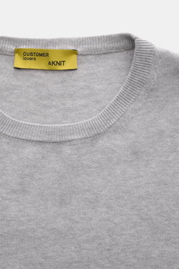 Close-up front view of B.F. Knitwear Crew neck jumper grey melange, showing fine knit pure cotton fabric with soft feel and ribbed comfortable bands, slim fit, and crew neck design. 

<p>A versatile essential for spring: This crew neck jumper in pure cott