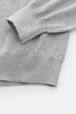 B.F. Knitwear Crew neck jumper grey melange shown from a close-up side angle highlighting the fine knit, ribbed bands, and soft pure cotton fabric. <p>A versatile essential for spring: This crew neck jumper in pure cotton by B.F. KNITWEAR enhances any war