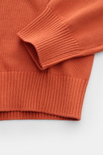 Close-up of the Gran Sasso Crew neck jumper orange showing ribbed sleeve cuffs and hem in fine knit cotton, photographed from above.

<p>This elegant Italian cotton jumper by GRAN SASSO enhances your spring wardrobe with a classic fit and a timelessly imm