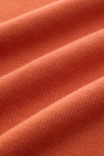 Close-up front view of the finely knitted orange fabric of the Gran Sasso Crew neck jumper orange, showcasing pure cotton texture.

<p>This elegant Italian cotton jumper by GRAN SASSO enhances your spring wardrobe with a classic fit and a timelessly immac