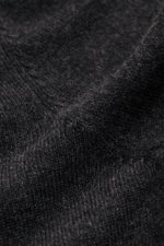 Close-up front view of the von Braun Cashmere crew neck jumper dark grey mottled, showing its pure cashmere fine knit texture and soft feel. A versatile essential for the colder months: This VON BRAUN fine knit jumper – made of luxurious Mongolian cashmer