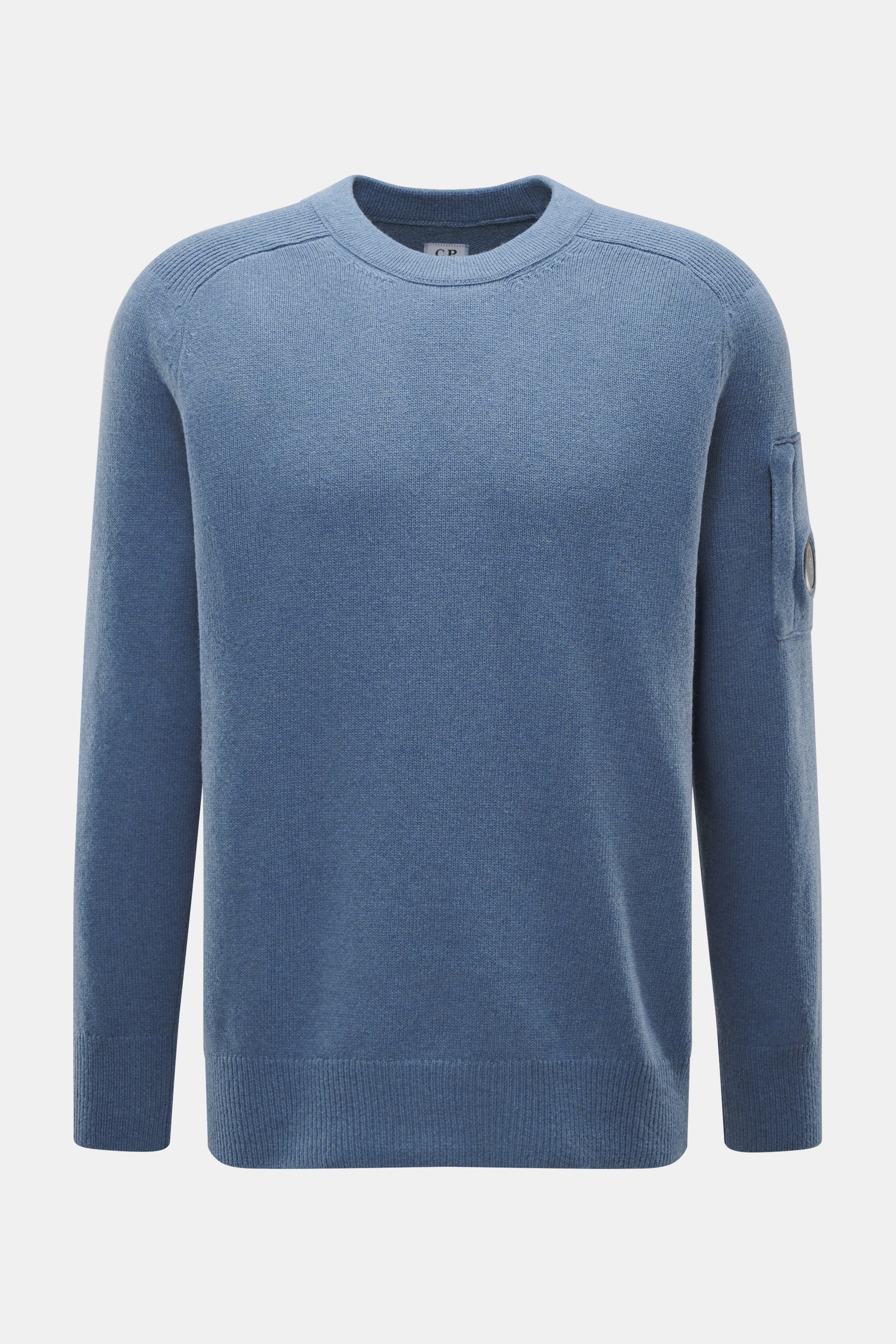 Front view of C.P. Company Crew neck sweater grey blue, a medium fine knit wool and microfiber blend with raglan sleeves, ribbed cuffs, and a zipped sleeve pocket featuring the brand's lens detail.

Description: 
<p>Timeless casual favorite: The knit swea