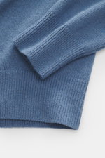Close-up of C.P. Company Crew neck sweater grey blue sleeve and cuff, showing medium fine knit and ribbed details from top-down view.

Description: <p>Timeless casual favorite: The knit sweater from C.P. COMPANY combines pleasant warmth with urban aesthet