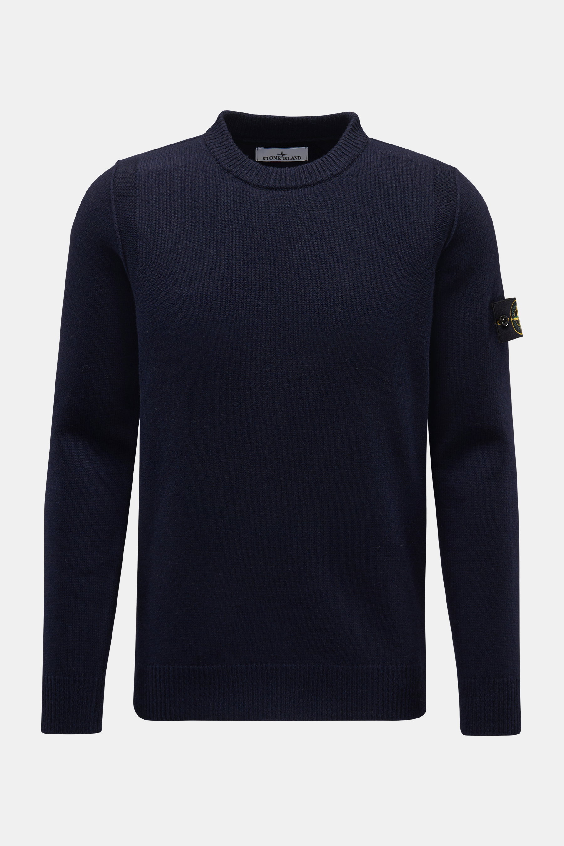 Front view of Stone Island Crew Neck Sweater 'Lambswool' navy, a slim fit casual sweater with ribbed cuffs and compass badge on the sleeve.

Description: <p>Stylish essential for the cold season: This casual sweater by STONE ISLAND made of a warm wool ble