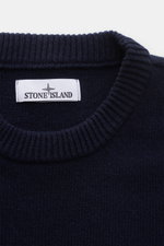 Close-up front view of the navy Stone Island Crew Neck Sweater 'Lambswool' showing ribbed crew neckline and brand label.

<p>Stylish essential for the cold season: This casual sweater by STONE ISLAND made of a warm wool blend impresses with distinctive li