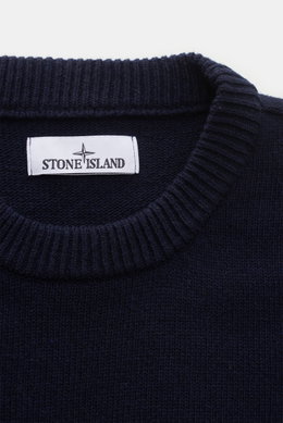 Close-up front view of the navy Stone Island Crew Neck Sweater 'Lambswool' showing ribbed crew neckline and brand label.

<p>Stylish essential for the cold season: This casual sweater by STONE ISLAND made of a warm wool blend impresses with distinctive li