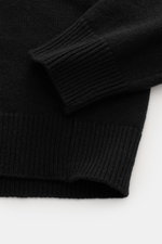 Close-up top-down view of Stone Island Crew Neck Sweater 'Lambswool' Black showing ribbed cuffs and medium-fine knit texture.

Description: Stylish essential for the cold season: This casual sweater by STONE ISLAND made from a warming wool blend impresses