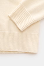 Close-up front view of Stone Island Crew Neck Sweater 'Lambswool' creme showing ribbed cuffs, medium-fine knit, and soft virgin wool blend.

Additional description:
<p>Stylish essential for the cold season: This casual sweater by STONE ISLAND made of a wa