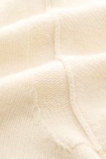 Close-up view of the Stone Island Crew Neck Sweater "Lambswool" creme showing its soft, medium-fine knit texture with contrast stripes.  

Description: 
<p>Stylish essential for the cold season: This casual sweater by STONE ISLAND made of a warm wool blen