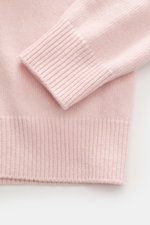 Close-up of the sleeve and hem of the Stone Island Crew Neck Sweater 'Lambswool' rose, showing soft, medium-fine knit wool blend from a top-down perspective.

Description: Stylish essential for the cold season: This casual sweater by STONE ISLAND made of 