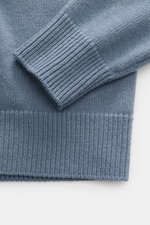 Close-up top view of Stone Island Crew Neck Sweater 'Lambswool' grey blue showing ribbed cuff and medium-fine knit texture.

Description: <p>Stylish essential for the cold season: This casual sweater by STONE ISLAND made of a warm wool blend impresses wit