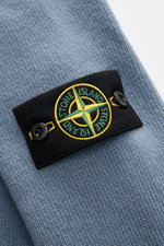 Close-up front view of Stone Island Crew Neck Sweater 'Lambswool' grey blue showing compass badge on sleeve, warm wool knit.

Description: <p>Stylish essential for the cold season: This casual sweater by STONE ISLAND made of a warm wool blend impresses wi