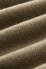 Close-up front view of the Stone Island Crew Neck Sweater 'Lambswool' grey green showing warm wool blend knit texture.

<p>Stylish essential for the cold season: This casual sweater by STONE ISLAND made of a warm wool blend impresses with distinctive link