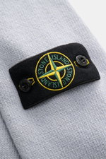 Close-up front angle of Stone Island Crew Neck Sweater 'Lambswool' smoky blue showing knit texture and iconic compass badge.

<p>Stylish essential for the cold season: This casual sweater by STONE ISLAND made of a warm wool blend impresses with distinctiv