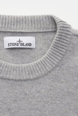 Stone Island Crew Neck Sweater 'Lambswool' Light Grey shown close-up from above, soft virgin wool blend, medium-fine knit, ribbed cuffs, and crew neckline. Stylish essential for cold season with distinctive link-knit details and iconic compass badge on th