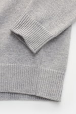 Close-up front view of the Stone Island Crew Neck Sweater 'Lambswool' Light Grey showing soft virgin wool knit with ribbed cuffs and medium-fine texture.

Description: <p>Stylish essential for the cold season: This casual sweater by STONE ISLAND made from