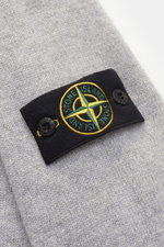 Stone Island Crew Neck Sweater 'Lambswool' Light Grey close-up from above showing soft wool blend knit, contrasting compass badge on sleeve. Stylish essential for the cold season: This casual sweater by STONE ISLAND made from a warming wool blend impresse
