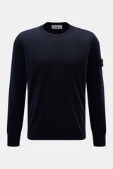 Front view of Stone Island Merino Crew Neck Sweater Navy, made of pure merino wool with fine knit, slim fit, crew neckline, ribbed cuffs, and compass badge on upper arm.