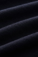 Close-up front view of Stone Island Merino Crew Neck Sweater Navy showing fine knit pattern and soft pure merino wool texture.

Description:  
<p>Timeless essential with iconic character: This STONE ISLAND crew neck sweater impresses with fine merino wool