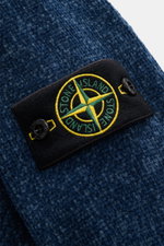 Stone Island Crewneck Sweater 'Chenille' Gray Blue shown in close-up from above, highlighting the soft cotton chenille knit and compass badge on the sleeve. Stay warm and stylish through winter with STONE ISLAND: This sweater made of soft cotton chenille 