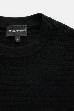 Emporio Armani Kurzarmpullover schwarz, Nahaufnahme von oben, feines Strukturstrickmuster, Rundhalsausschnitt, reine Schurwolle, weicher Griff, Regular Fit.