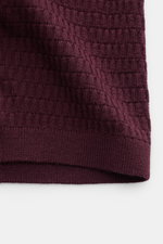 Close-up front view of the Emporio Armani Short sleeve jumper burgundy showing fine textured knit in pure virgin wool.

Description:  
<p>Versatile companion: This lightweight short sleeve jumper in pure virgin wool by EMPORIO ARMANI has a subtle textured