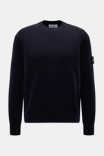 Stone Island Crew Neck Sweater Navy shown from the front, featuring raglan sleeves, compass badge on upper arm, crew neckline, ribbed cuffs, regular fit, fine knit pattern, soft virgin wool blend for warming comfort and sporty style.