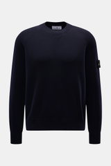 Stone Island Crew Neck Sweater Navy shown from the front, featuring raglan sleeves, compass badge on upper arm, crew neckline, ribbed cuffs, regular fit, fine knit pattern, soft virgin wool blend for warming comfort and sporty style.