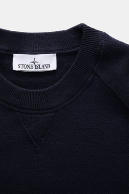 Stone Island Crew Neck Sweater Navy shown in close-up from above, highlighting the fine knit pattern, crew neckline, and soft texture. Warming comfort with iconic character: This STONE ISLAND sweater combines a high-quality wool blend with sporty style. R