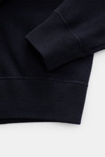 Stone Island Crew Neck Sweater Navy shown close-up from a top angle, highlighting ribbed cuffs, fine knit, and soft virgin wool blend fabric. Warming comfort with iconic character: This STONE ISLAND sweater combines a high-quality wool blend with sporty s
