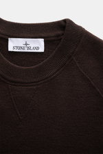 Close-up top view of the Stone Island Dark Brown Crew Neck Sweater showing the ribbed crew neckline and fine knit pattern in a soft virgin wool blend.

Description: <p>Warming comfort with iconic character: This STONE ISLAND sweater combines a premium woo