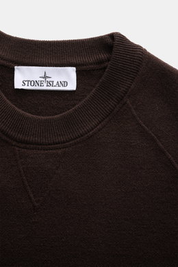 Close-up top view of the Stone Island Dark Brown Crew Neck Sweater showing the ribbed crew neckline and fine knit pattern in a soft virgin wool blend.

Description: <p>Warming comfort with iconic character: This STONE ISLAND sweater combines a premium woo