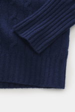 Close-up front view of Drumohr Cashmere crew neck sweater dark blue showing classic cable knit, ribbed cuffs, pure cashmere, slim fit, and soft medium-fine texture.