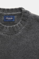 Close-up front view of Drumohr Cashmere crew neck jumper dark grey showing chunky knit texture, rib-knit cuffs, and label.

Description: <p>Stay comfortably warm through the autumn/winter season with this ultra-soft crew neck sweater made from chunky cash
