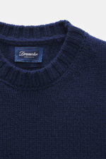Close-up front top view of Drumohr Cashmere Crew Neck Sweater Dark Blue showing chunky knit, slim fit, crew neckline, and ribbed cuffs, pure cashmere, very soft touch.