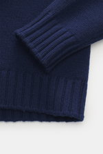 Close-up view of Drumohr Cashmere Crew Neck Sweater Dark Blue showing chunky knit, ribbed cuffs, and slim fit texture.

Description: <p>Stay comfortably warm through the autumn/winter season with this ultra-soft crew neck sweater made from chunky cashmere