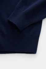 Fioroni Cashmere Crewneck Sweater dark blue shown from close-up top side angle, pure baby cashmere, very soft feel, fine knit pattern, slim fit, crew neckline, flexible ribbed cuffs.