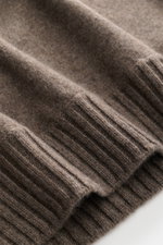 Close-up, angled view of the ribbed cuffs and fine knit texture of the Fioroni Cashmere Crew Neck Sweater 'Duvet' Grey Brown Melange, showcasing luxurious warmth with Italian craftsmanship: made from pure cashmere with a very soft touch, slim fit, crew ne