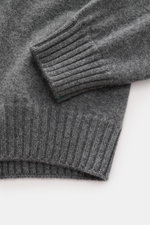 Close-up front view of Fioroni Cashmere Crew Neck Sweater 'Duvet' Dark Grey Melange showing ribbed cuffs and fine knit texture, pure cashmere, soft touch, slim fit, crew neckline, flexible ribbed cuffs.