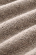 Close-up front view of Fioroni Cashmere Crew Neck Sweater 'Duvet' Taupe Melange showing fine knit texture and soft cashmere fabric.