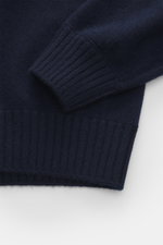 Gran Sasso Cashmere crew neck sweater navy shown from above, highlighting pure cashmere, very soft feel, fine knit pattern, regular fit, crew neckline, comfortable ribbed cuffs.