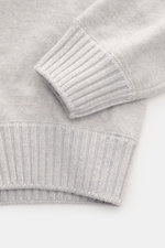 Close-up top-down view of the Gran Sasso Cashmere crew neck sweater light grey melange showing the fine knit pattern, pure cashmere fabric, very soft feel, regular fit, crew neckline, and comfortable ribbed cuffs.