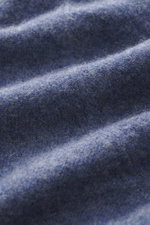 Close-up front view of Gran Sasso Cashmere crew neck sweater smoky blue/dark blue melange showing pure cashmere, very soft feel, fine knit pattern, regular fit, crew neckline, and comfortable ribbed cuffs.