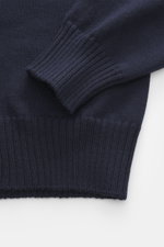 Gran Sasso Crew neck sweater navy close-up from above showing soft touch pure virgin wool, medium-fine knit, slim fit, crew neckline, and ribbed cuffs.