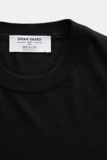 Gran Sasso Fine-knit crew neck sweater black shown from top front close-up, mix of virgin wool, cashmere, and silk, very soft feel, lightweight quality, very fine knit pattern, regular fit, crew neckline, comfortable ribbed cuffs.