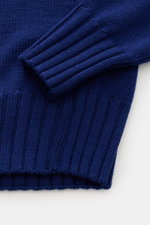 Close-up front view of B.F. Knitwear Merino crew neck jumper dark blue, showing sleeve and hem details with pure merino wool, soft feel, semi chunky knit, slim fit, crew neck, rib knit bands.
