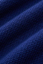 Close-up shot of B.F. Knitwear Merino crew neck jumper dark blue, showing pure merino wool, soft feel, semi chunky knit, slim fit, crew neck, rib knit bands.